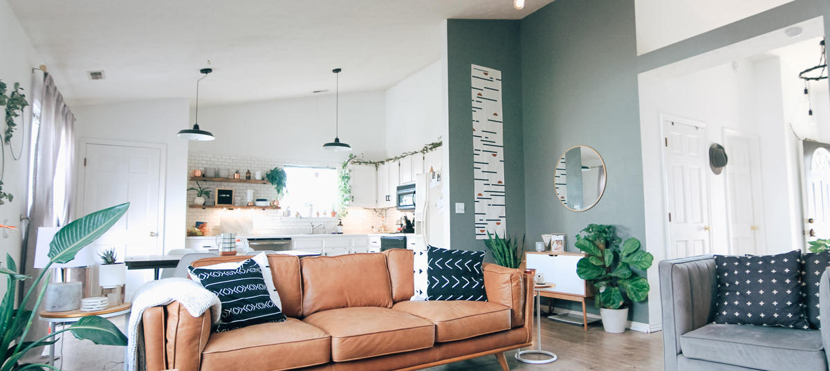 Bright contemporary home interior with bold jade accent wall in living room in Johnson City, TN